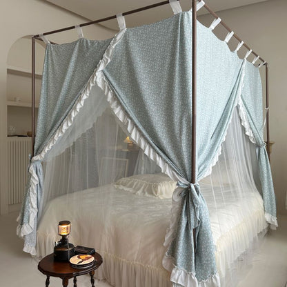 Vintage floral bed canopy with ruffled trim over a four-poster bed in a cozy bedroom
