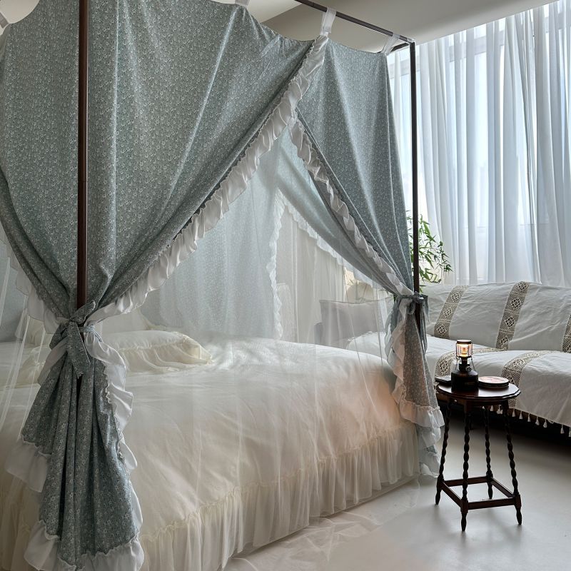 Vintage floral bed canopy with ruffled trim in a bright, elegant bedroom with natural bedding.