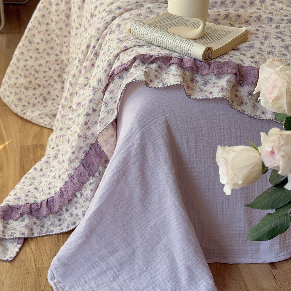Vintage-style cotton gauze comforter in lavender floral print with solid lilac flat sheet