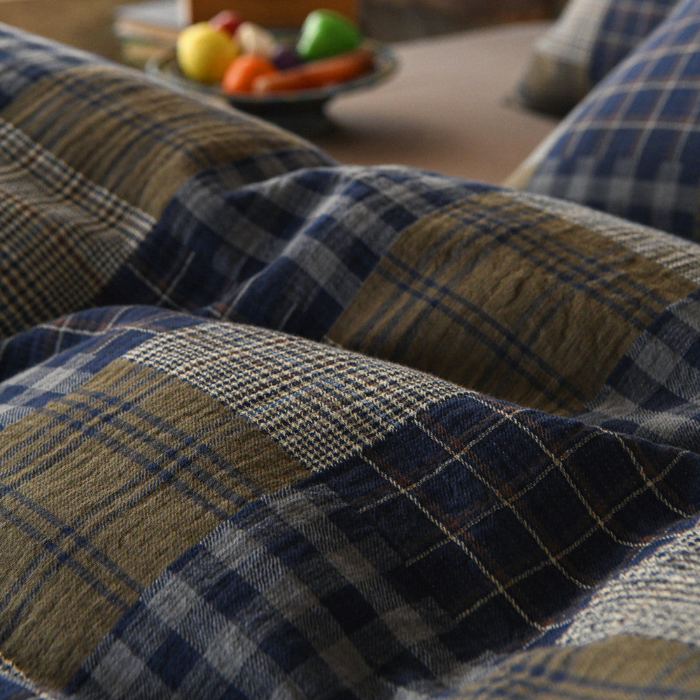 Close-up of plaid fabric with a blurred background