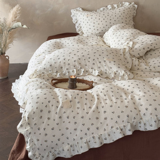 Full shot of a Twin-size bed styled with the Wild Pansy duvet cover set, highlighting the cozy, relaxed look of the ruffled bedding and the complete set.