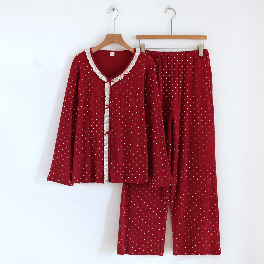Red cotton pajama set for women with white heart pattern and ruffle trim, long sleeves and pants