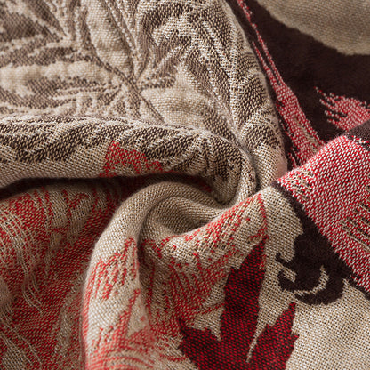 Close-up of jacquard-woven chickadee and leaf texture in cotton yarn