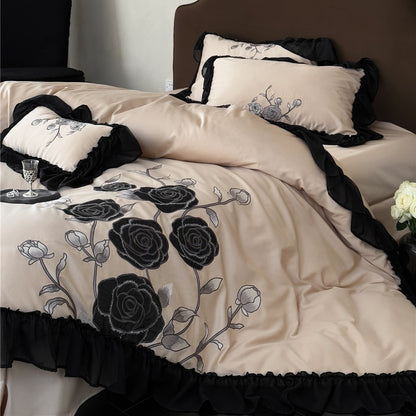Warm taupe bedding with black floral embroidery and trim