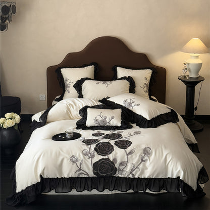 Black rose duvet cover set in ivory with full ruffled trim
