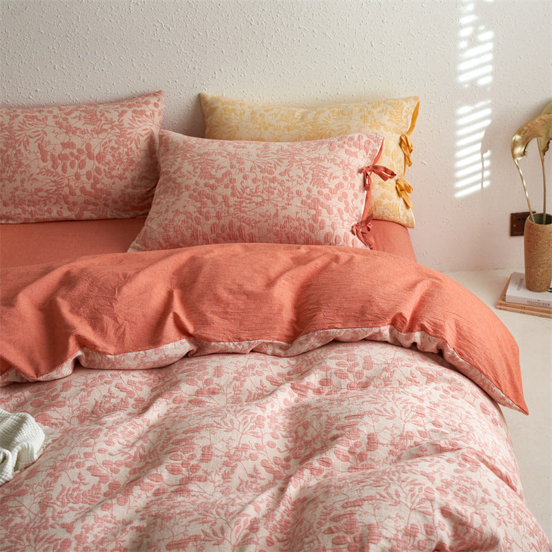 Blush pink jacquard duvet cover detail showing corner ties and textured weave