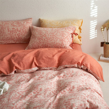 Blush pink jacquard duvet cover detail showing corner ties and textured weave