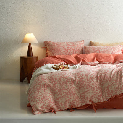 Full bed styled with cotton botanical jacquard duvet and coordinated pillow shams