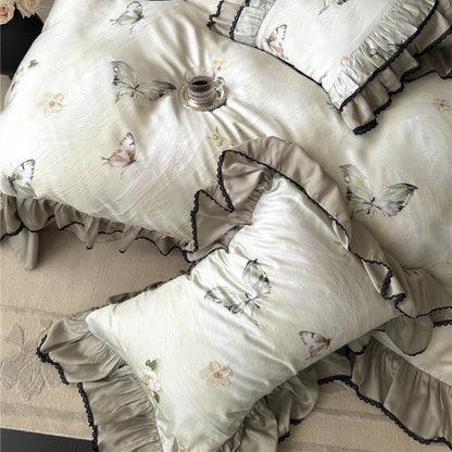 Matching pillowcases with butterfly print and ruffled black lace trim