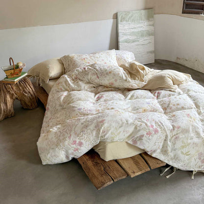 Full bed setup with floral bedding and blush solid back – airy and reversible design