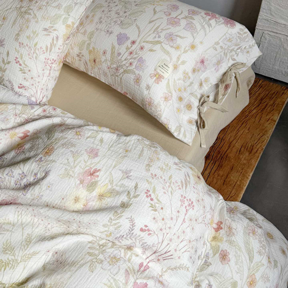 Close-up of floral pillowcase and solid back sheet – soft and natural cotton texture