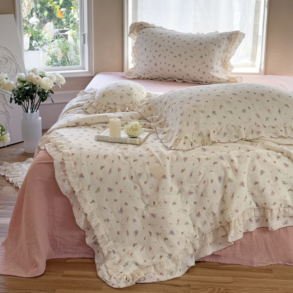 Close-up of romantic floral cotton comforter with vintage ruffles