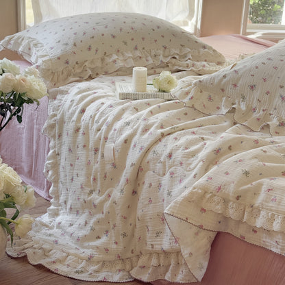 Lightweight floral comforter on soft gauze bedding in airy bedroom