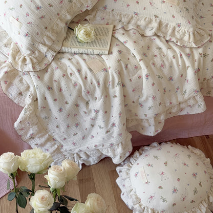 Breathable floral cotton comforter layered with vintage-inspired bedding