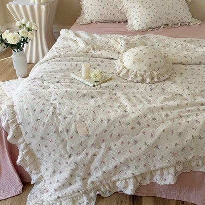 Floral Cotton Comforter with vintage charm and lace detail on bed