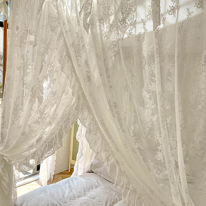 Floral lace ruffle canopy curtains on a four-poster bed with natural light, airy and elegant design