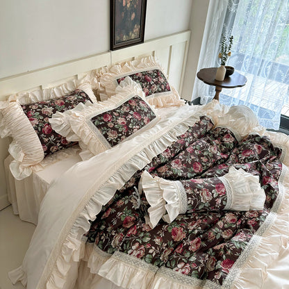 Side angle of vintage rose bedding in dark floral print