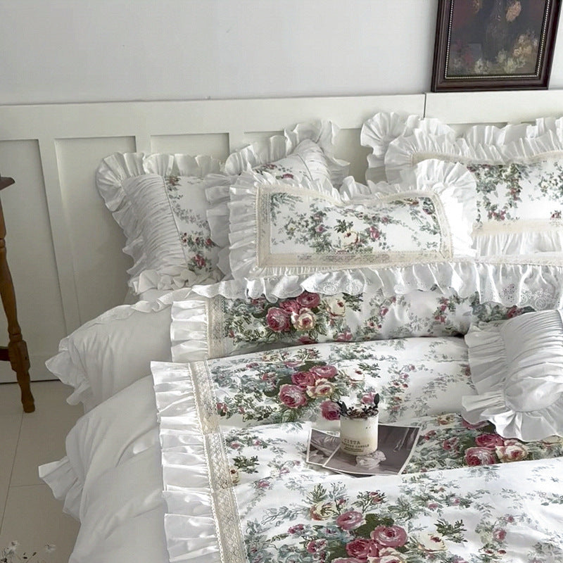Full bed view of white floral cotton bedding set with ruffles