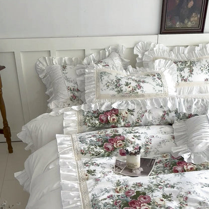 Full bed view of white floral cotton bedding set with ruffles