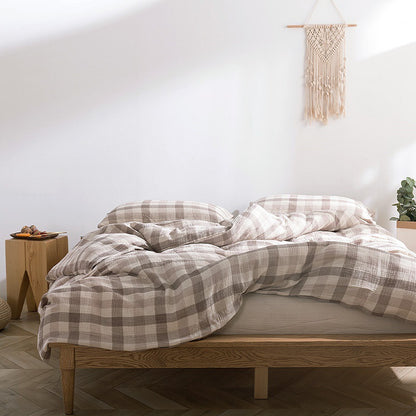 Soft gauze bedding in beige plaid with natural light