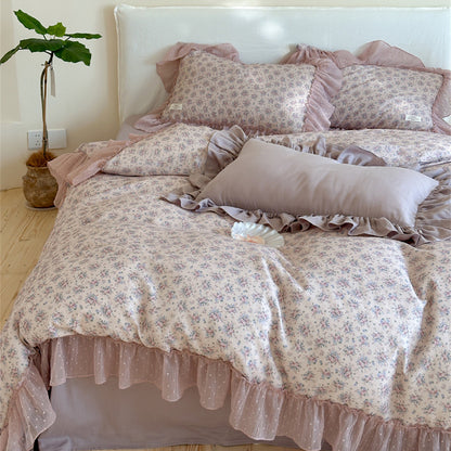 Full view of the Lavender Floral Ruffled Cotton Gauze Bedding Set: Complete display of the bed, including the duvet cover with a sheer ruffled edge, two floral pillow shams, and a solid-colored rectangular bolster pillow, creating a sweet cottagecore aesthetic.