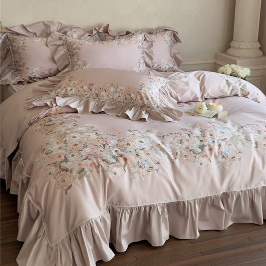 Overhead view of blush pink Romantic Rose bedding set, showing all ruffled components including shams and sheet.