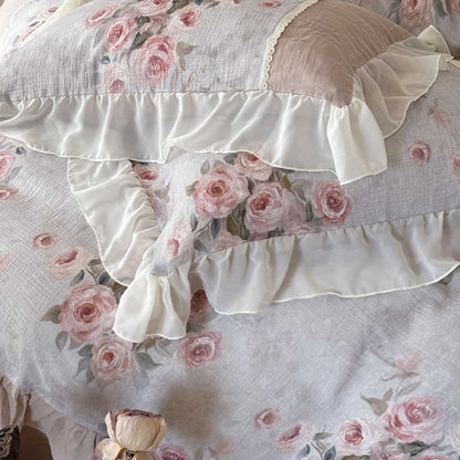 Close-up of vintage floral print and chiffon ruffle on romantic cotton gauze bedding