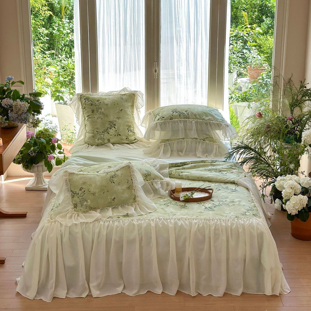 Elegant garden-style green comforter with soft ruffles