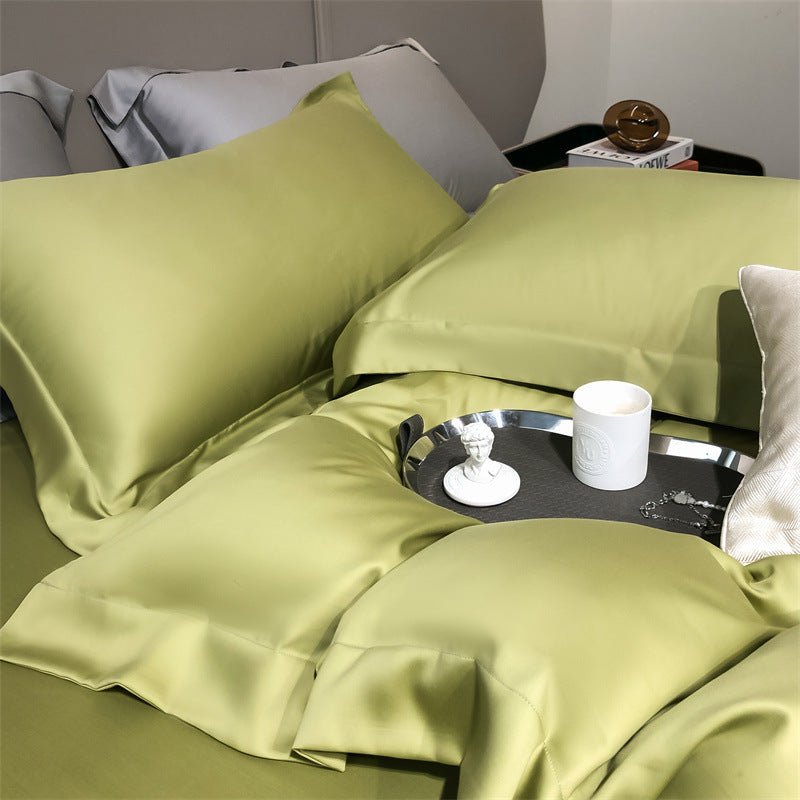 Green Tencel Lyocell silky cooling pillowcases and bedding on StuffedHome bed