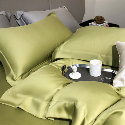 Green Tencel Lyocell silky cooling pillowcases and bedding on StuffedHome bed
