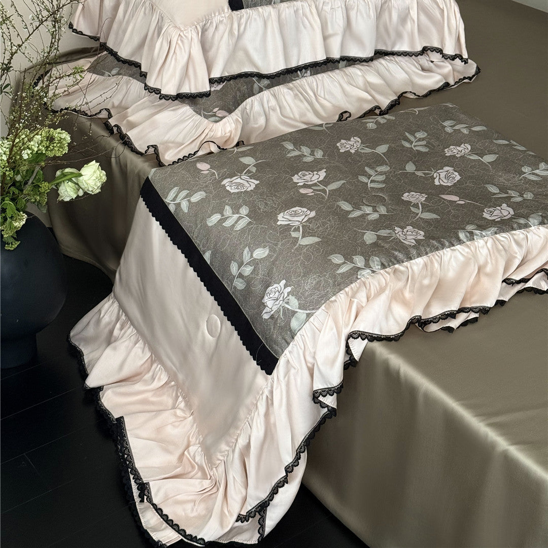Pillowcase detail with ruffled edges in olive gray rose bedding set