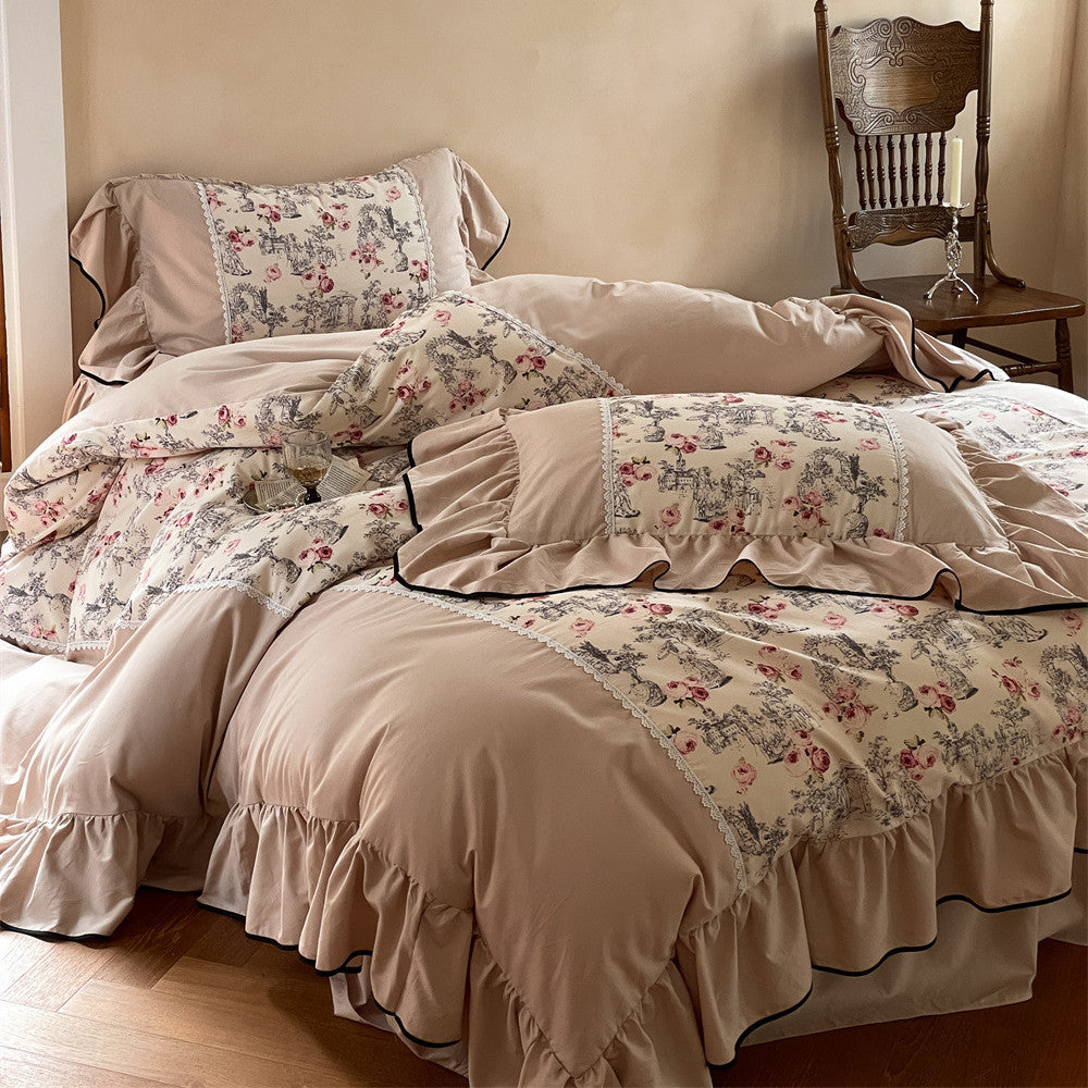 Full bed display with toile floral bedding set and ruffled pillow shams