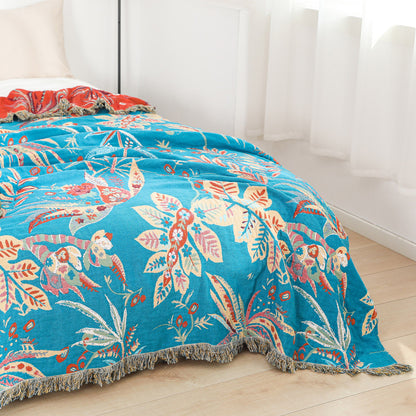 Bright floral jacquard throw blanket styled on full-size bed