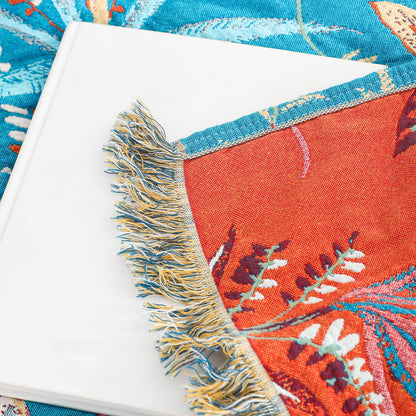 Close-up of cotton jacquard fabric with colorful tropical leaves