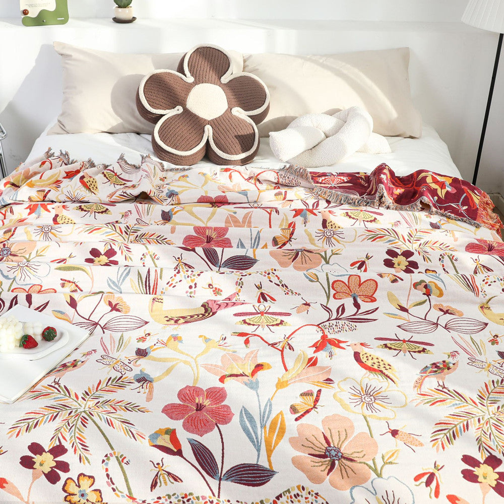 Close-up texture of woven floral and animal design